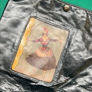 Elegant Black Leather Crossbody Bag with Artistic Design